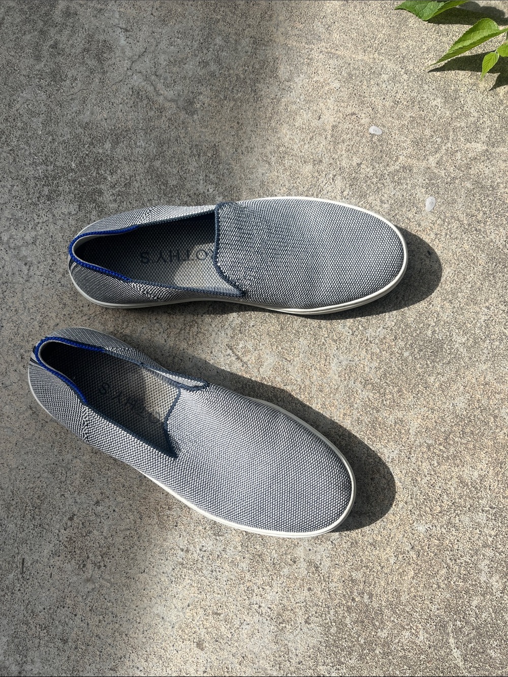 Rothy's Slip-On Sneakers in Light Gray with Blue Trim